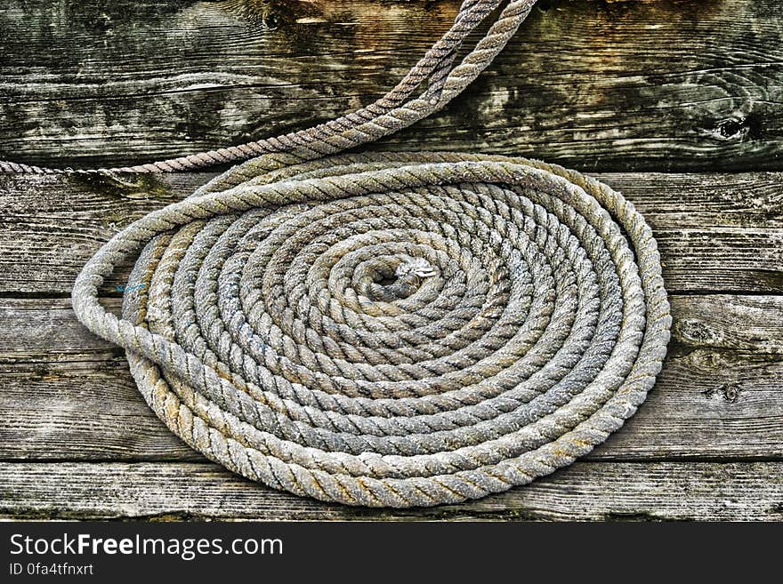 Grey Braided Rope on Wooden Plank