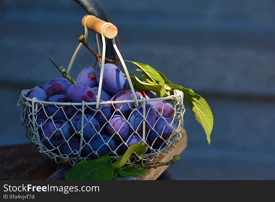 Red Grape Fruits on Metal Basket