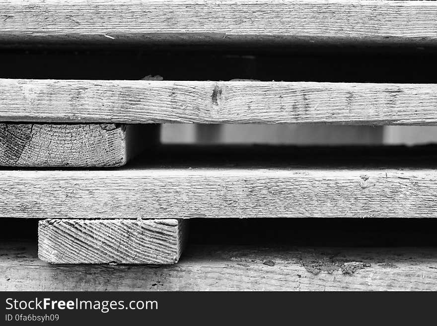 A black and white background of industrial wood.