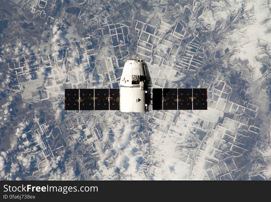 Spacex satellite orbiting from above. Spacex satellite orbiting from above.