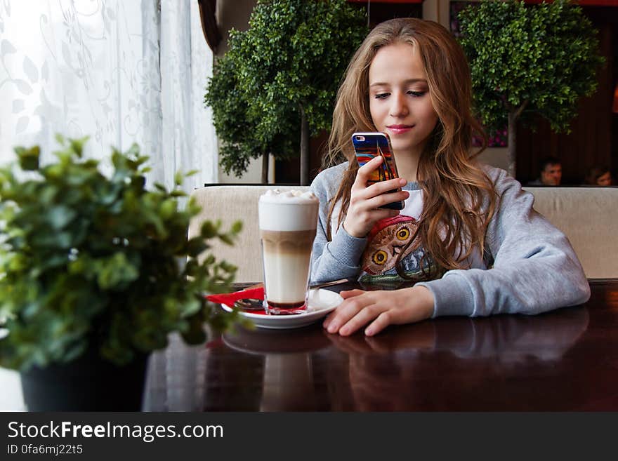 Portrait of Woman Photographing With Smart Phone