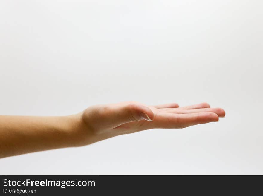 Close-up of Hand over White Background