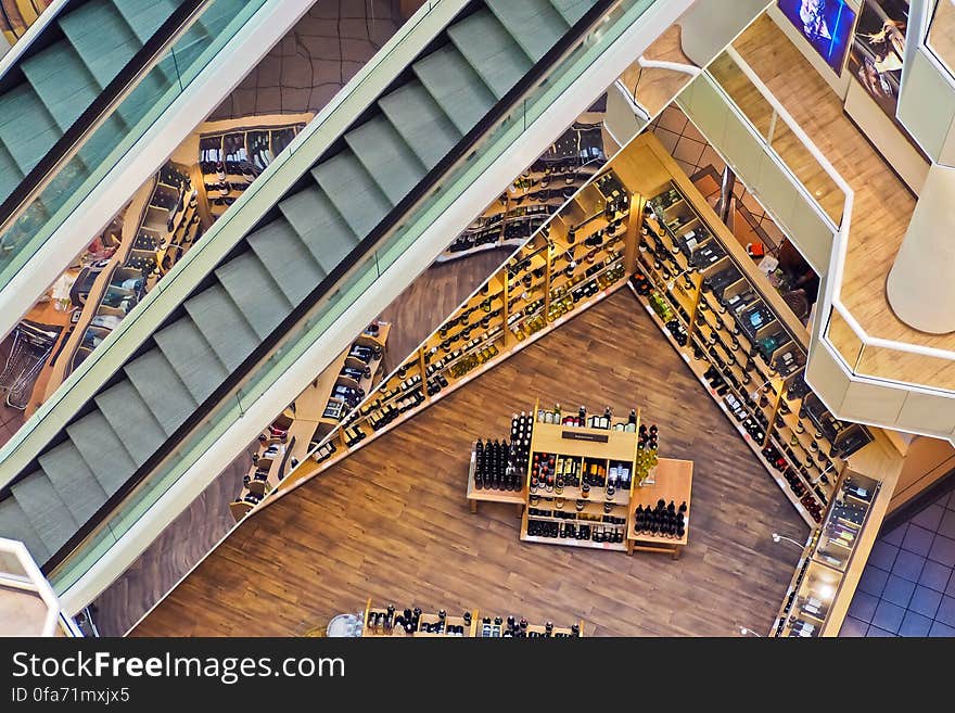 Aerial view of empty escalator inside modern shopping mall apparel shop. Aerial view of empty escalator inside modern shopping mall apparel shop.