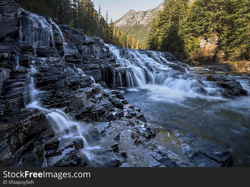 A river cascading over rocks in the wild. A river cascading over rocks in the wild.