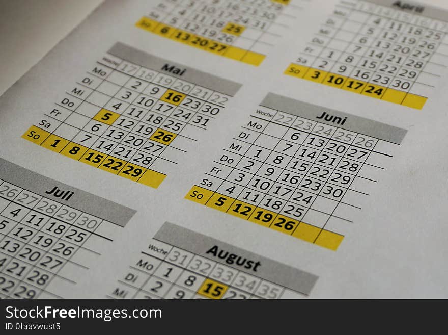 Close up of annual calendar page with months and dates in tables.