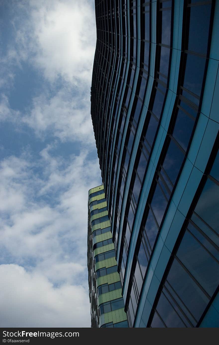 Facade of modern buildings against blue skies on sunny day. Facade of modern buildings against blue skies on sunny day.