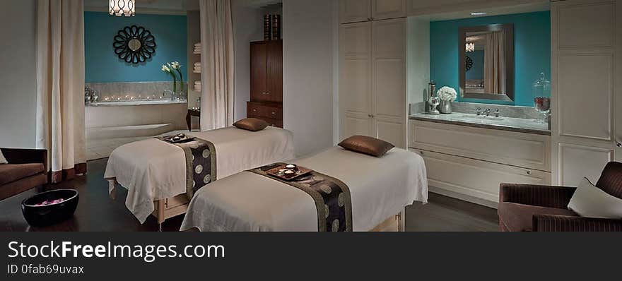 Twin beds in a luxurious modern hotel bedroom. Twin beds in a luxurious modern hotel bedroom.