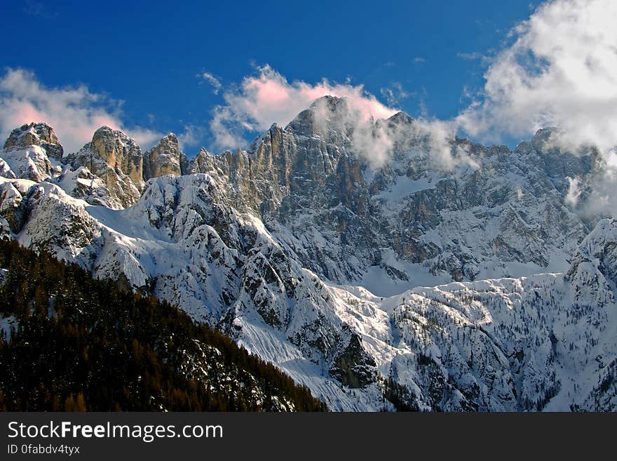 Snowy mountain range with blue skies. Snowy mountain range with blue skies.