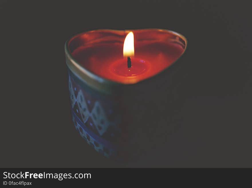 Close-up of Tea Light Candle Against Black Background