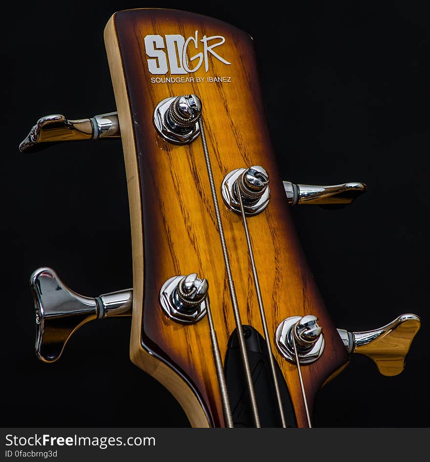 Close up of control knobs on neck of sound gear guitar. Close up of control knobs on neck of sound gear guitar.