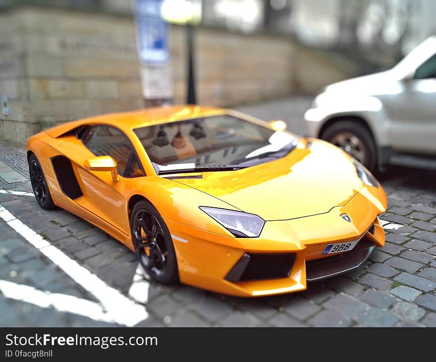 Yellow Sports Car during Day Time