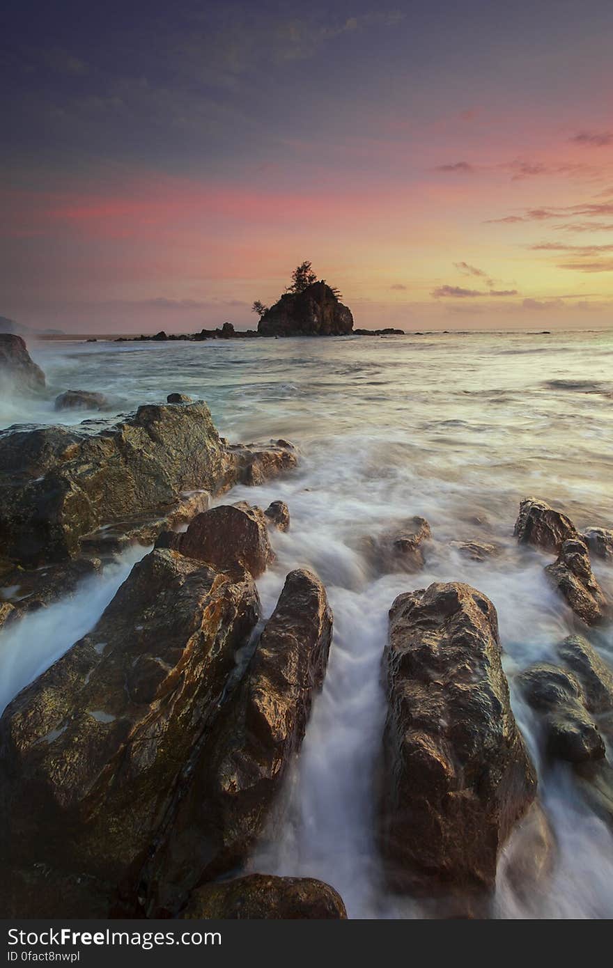 Running Water on Brown Rocks during Yellow Sunset