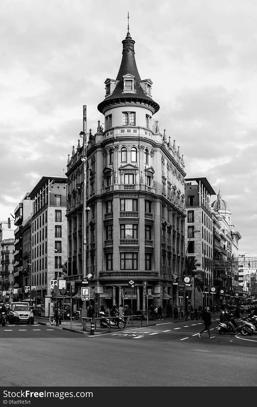 Grayscale Photo of White Concrete Building Under the White Sky