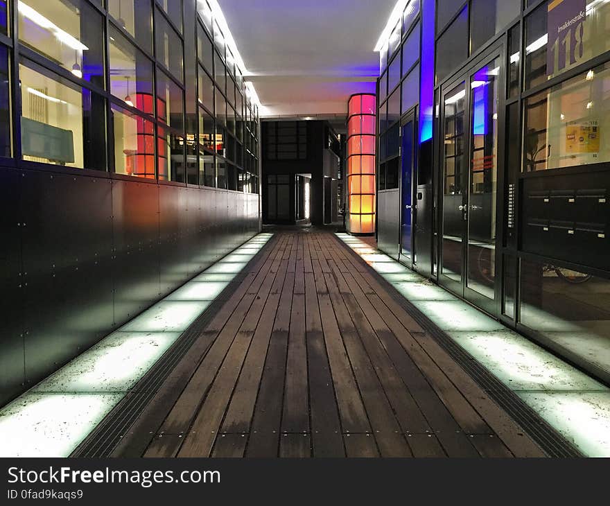 Colorful lights inside hallway through modern building. Colorful lights inside hallway through modern building.