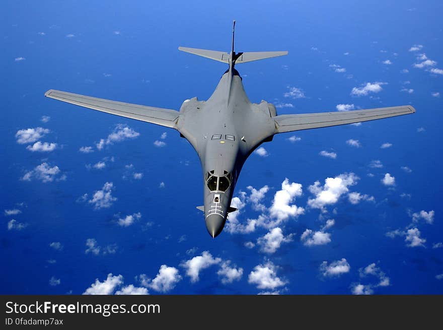 Black Fighter Jet Near White Clouds