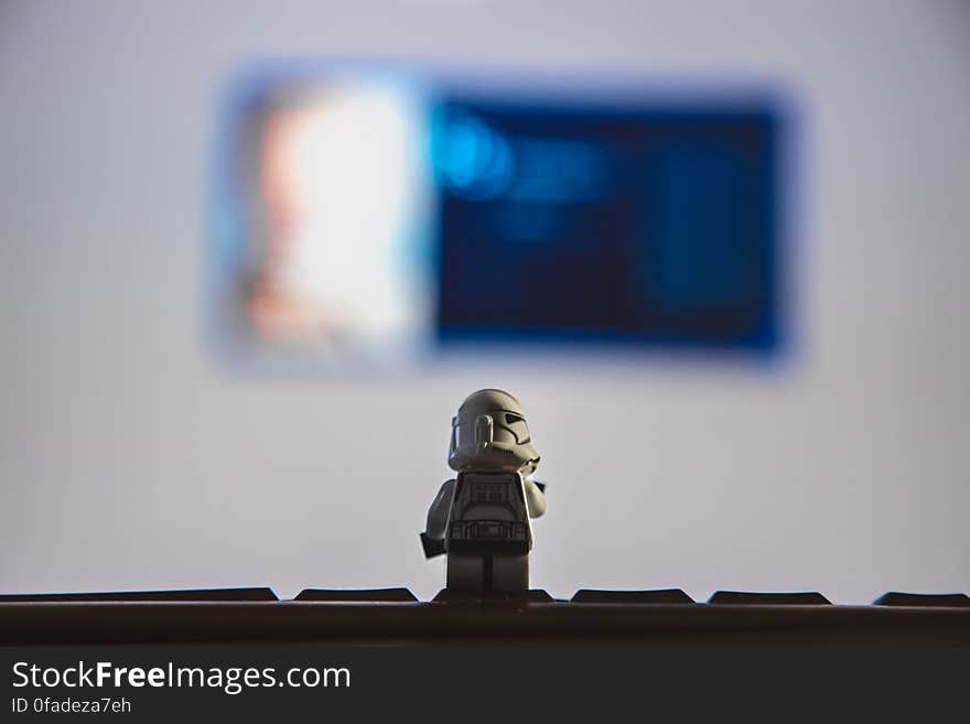 Lego's Star Wars storm trooper toy on desk indoors. Lego's Star Wars storm trooper toy on desk indoors.