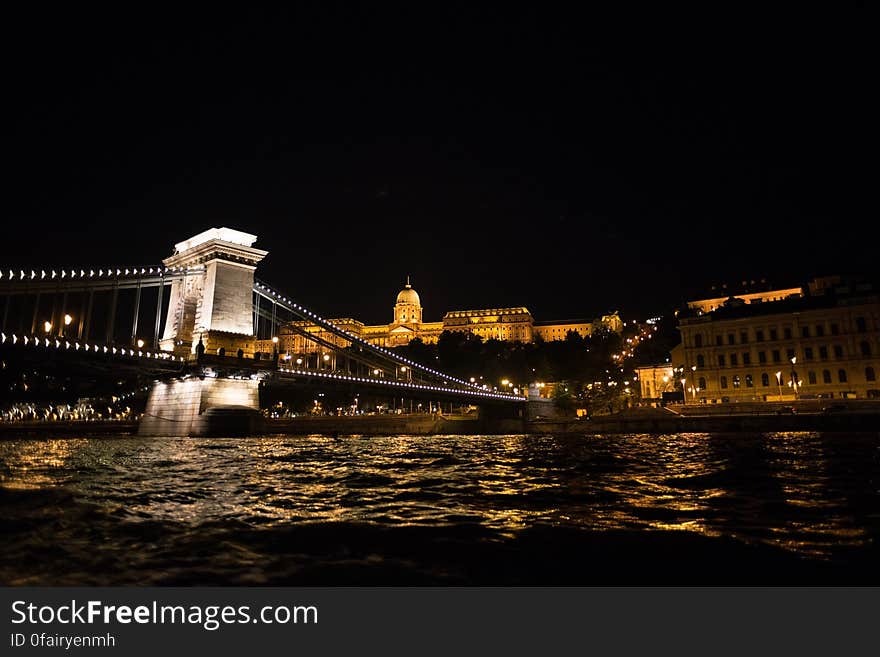 Night skyline of hillside castle overlooking bridge spanning the River Danube. Night skyline of hillside castle overlooking bridge spanning the River Danube.