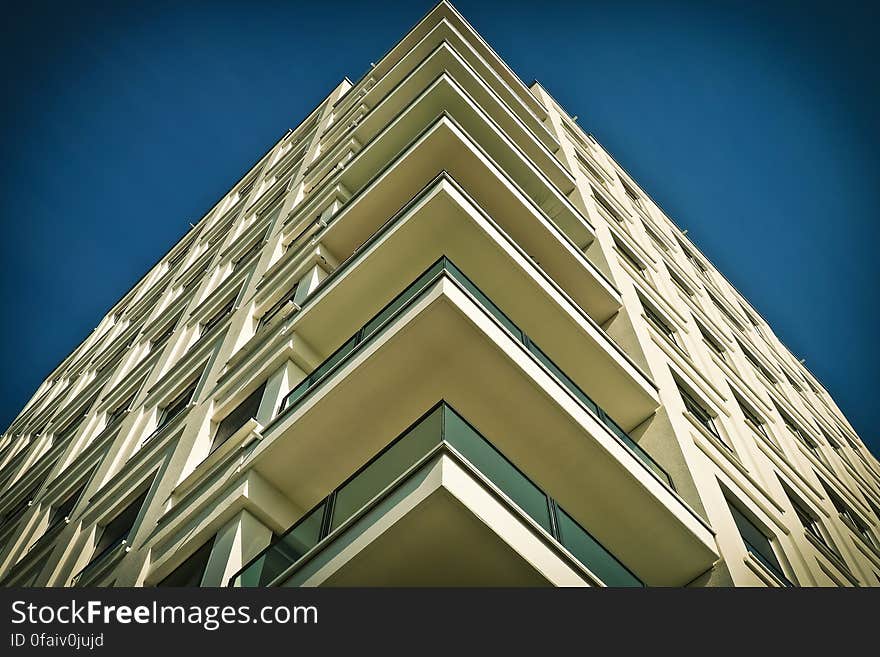 Balconies on a tall modern residential building from low angle. Balconies on a tall modern residential building from low angle.