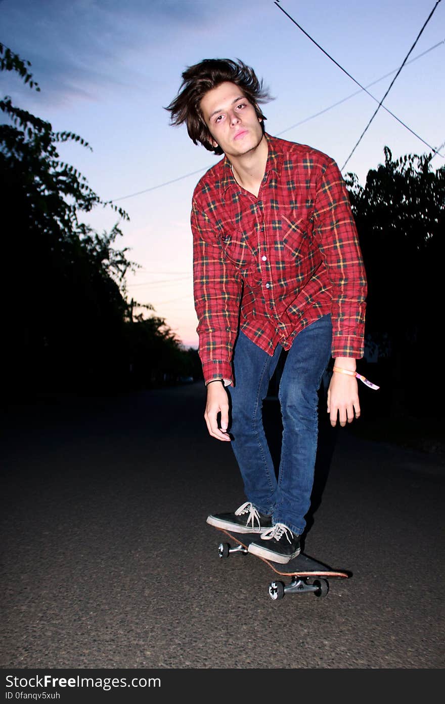 Jeans, Shoe, Sky, Sports equipment, Skateboard truck, Tartan