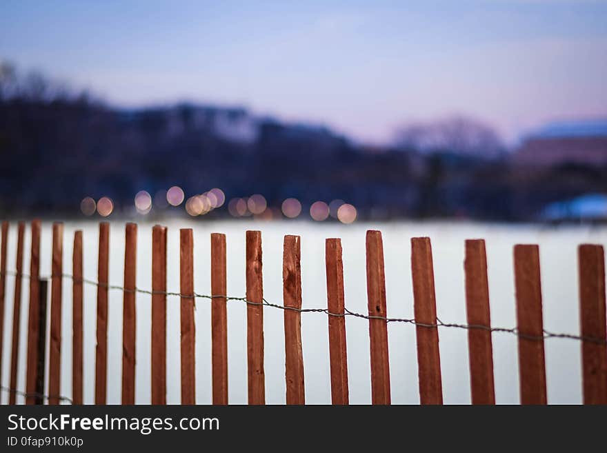 A cedar wood fence bars access to the Ellipse, a large lawn in front of the White House, on a snowy day in Washington, DC. Dedicated to the public domain with a CC0 license. A cedar wood fence bars access to the Ellipse, a large lawn in front of the White House, on a snowy day in Washington, DC. Dedicated to the public domain with a CC0 license.