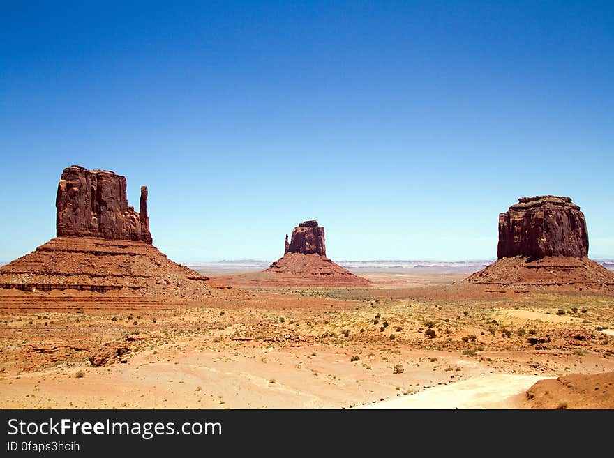 Mitten sandstone buttes in Monument Valley, Arizona on sunny day.