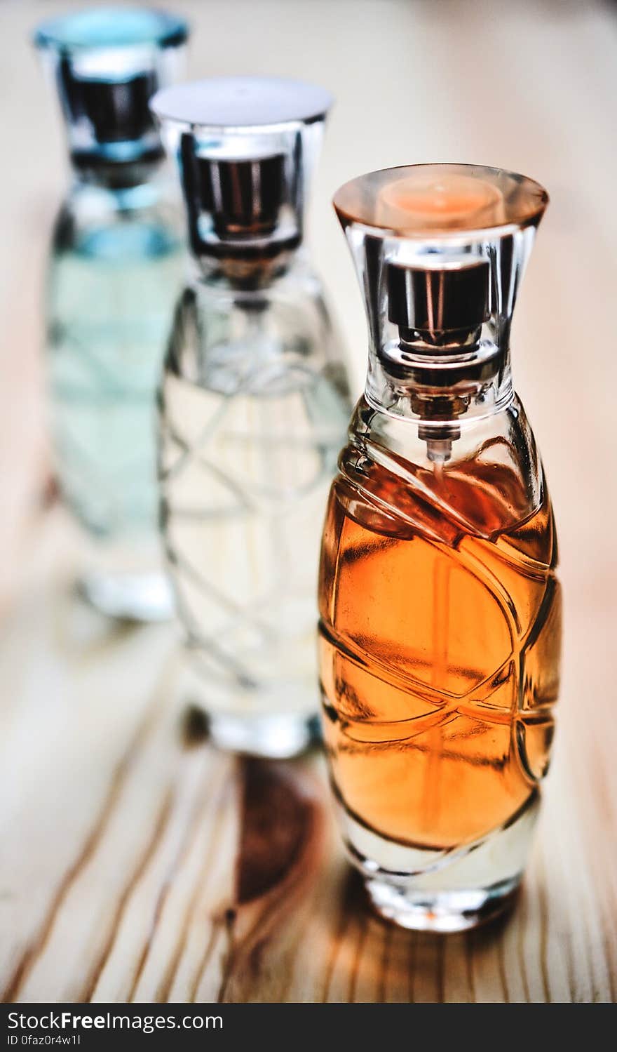 A row of colorful perfume bottles.