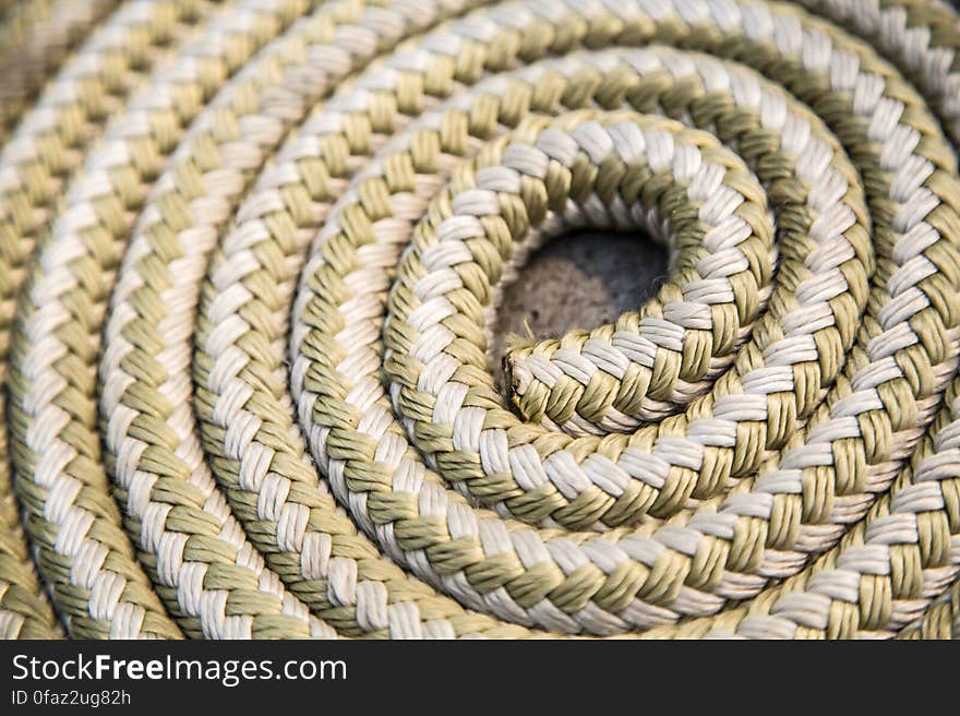 A close up of a length of a rope coiled up. A close up of a length of a rope coiled up.