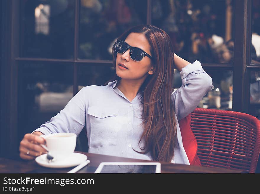 Portrait of Young Woman Drinking Coffee at Home