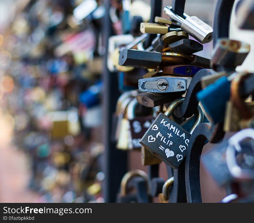 Love locks attached to the railing in the city.