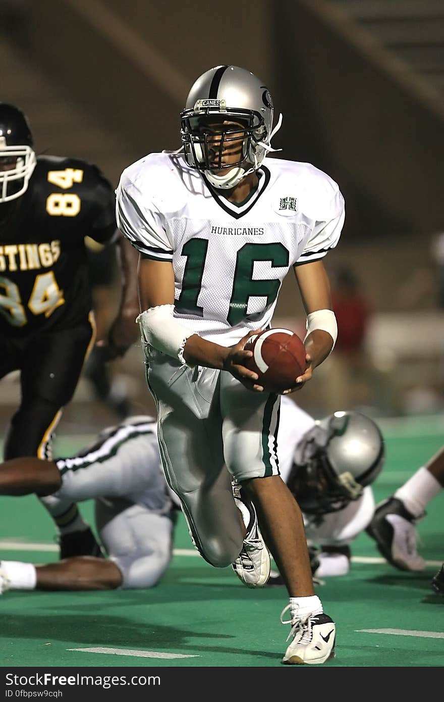 Man in White 16 Football Jersey While Playing Football