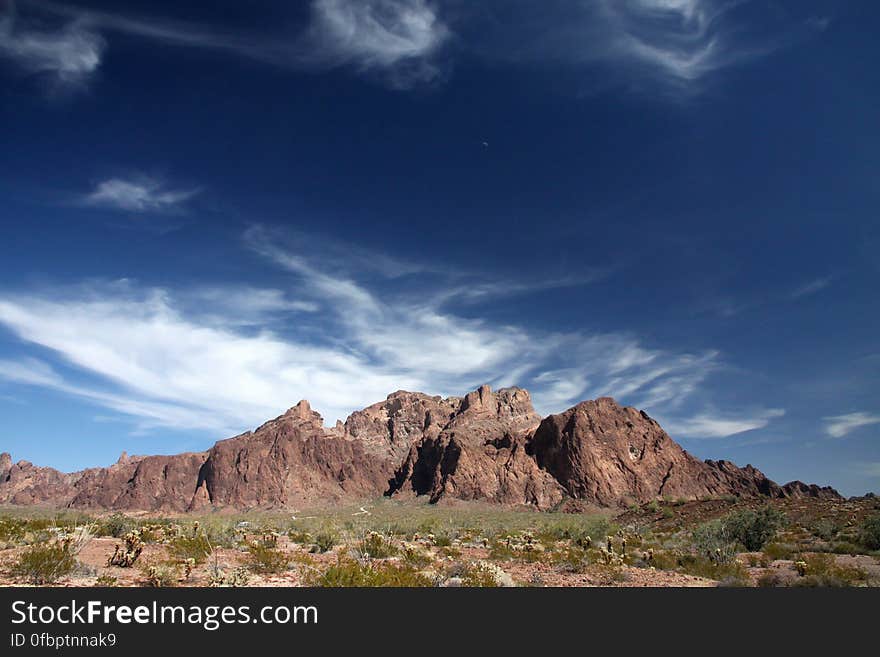 Brown Mountain Under Blue and White Sky during Daytime