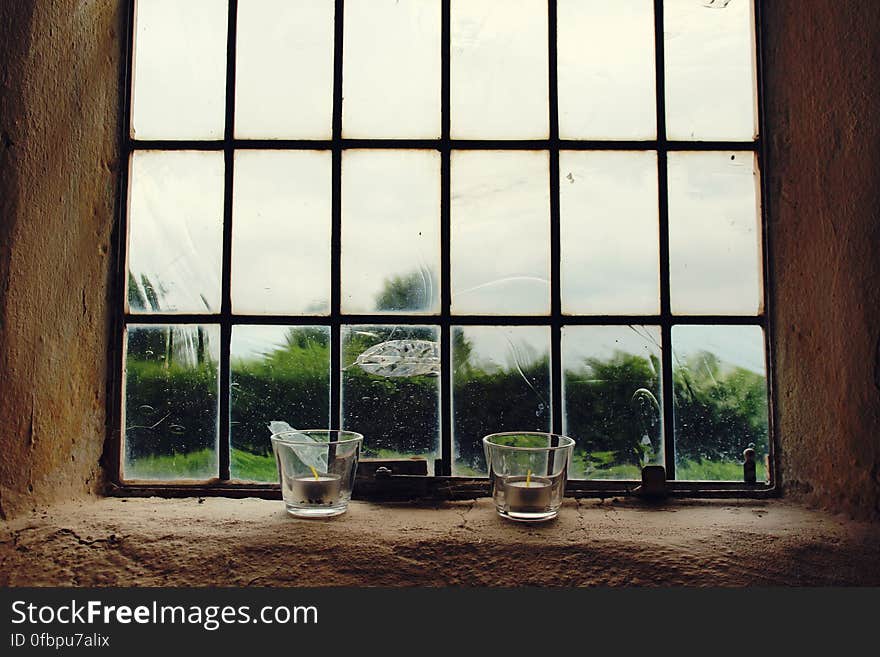 Clear Drinking Glass Near Window during Daytime