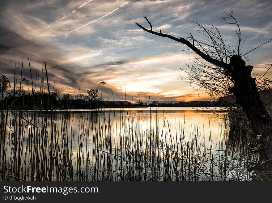 Scenic View of Lake Against Sky during Sunset