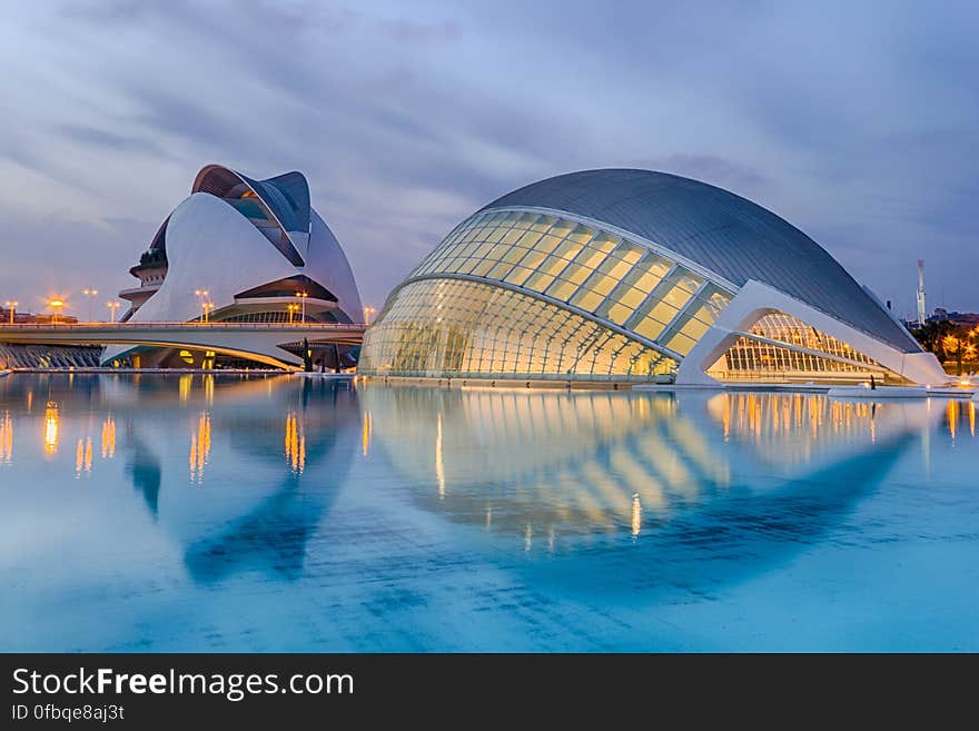 Reflection of Cityscape in Sea at Night