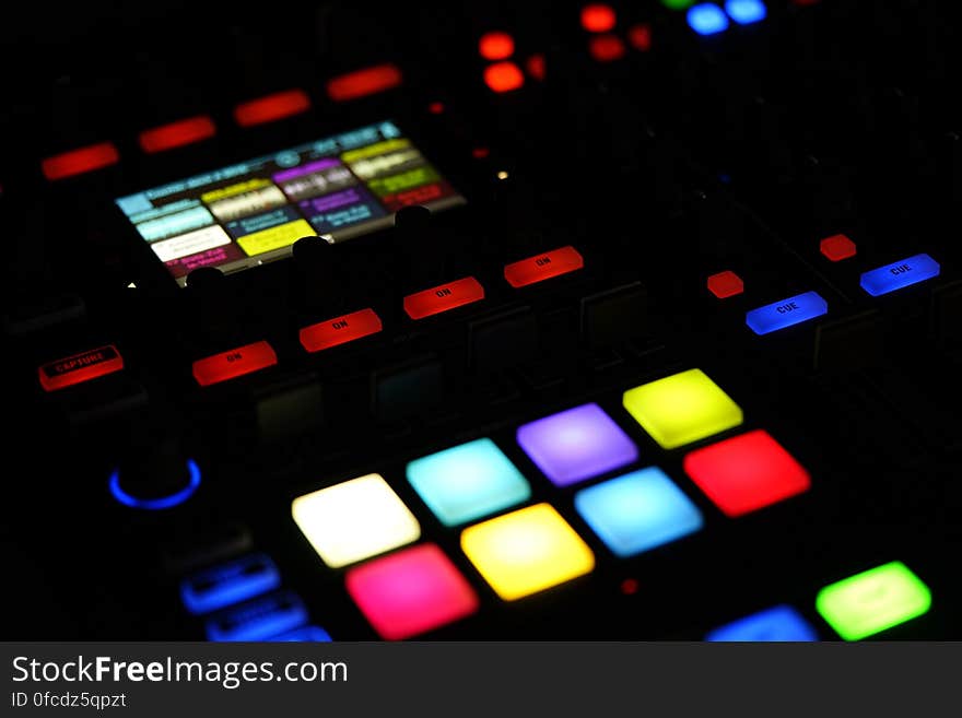 Colorful illuminated buttons and display on electronics control panel. Colorful illuminated buttons and display on electronics control panel.