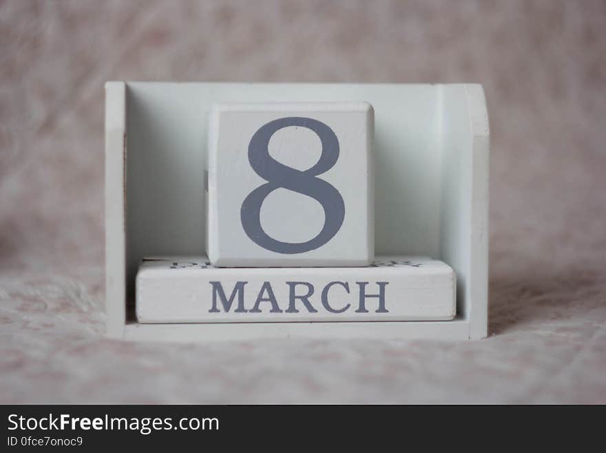 Wooden calendar blocks displaying March 8 on desktop. Wooden calendar blocks displaying March 8 on desktop.