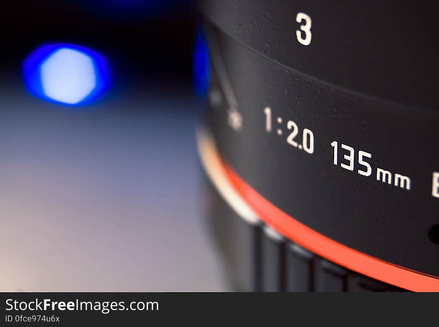 Close up of 135mm camera lens with bokeh light. Close up of 135mm camera lens with bokeh light.