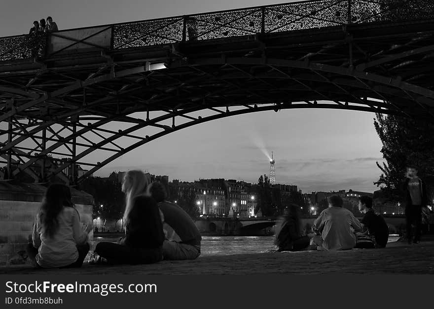 Relaxing under the Pont des Arts in Paris. Relaxing under the Pont des Arts in Paris.