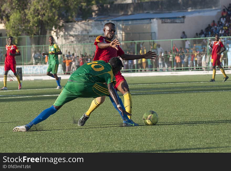 A Heegan player tries to steal the ball from a Horseed player during a game between the two football clubs held at Banadir Stadium on 31st January 2014. AU UN IST PHOTO / David Mutua. A Heegan player tries to steal the ball from a Horseed player during a game between the two football clubs held at Banadir Stadium on 31st January 2014. AU UN IST PHOTO / David Mutua