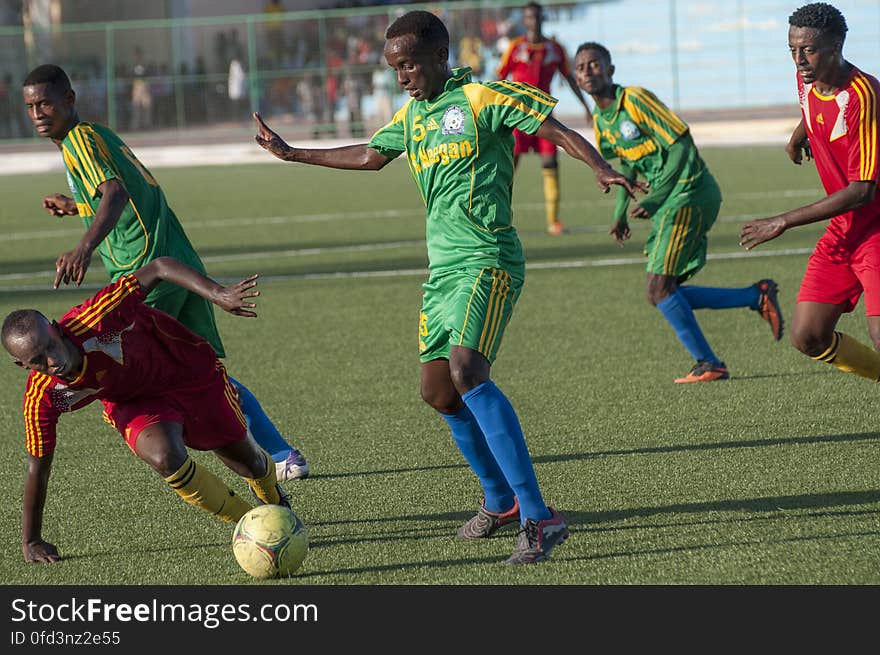 A Horseed player stumbles as a Heegan player tries to steal the ball during a game between Heegan and Horseed football clubs at Banadir Stadium on 31st January 2014. AU UN IST PHOTO / David Mutua. A Horseed player stumbles as a Heegan player tries to steal the ball during a game between Heegan and Horseed football clubs at Banadir Stadium on 31st January 2014. AU UN IST PHOTO / David Mutua