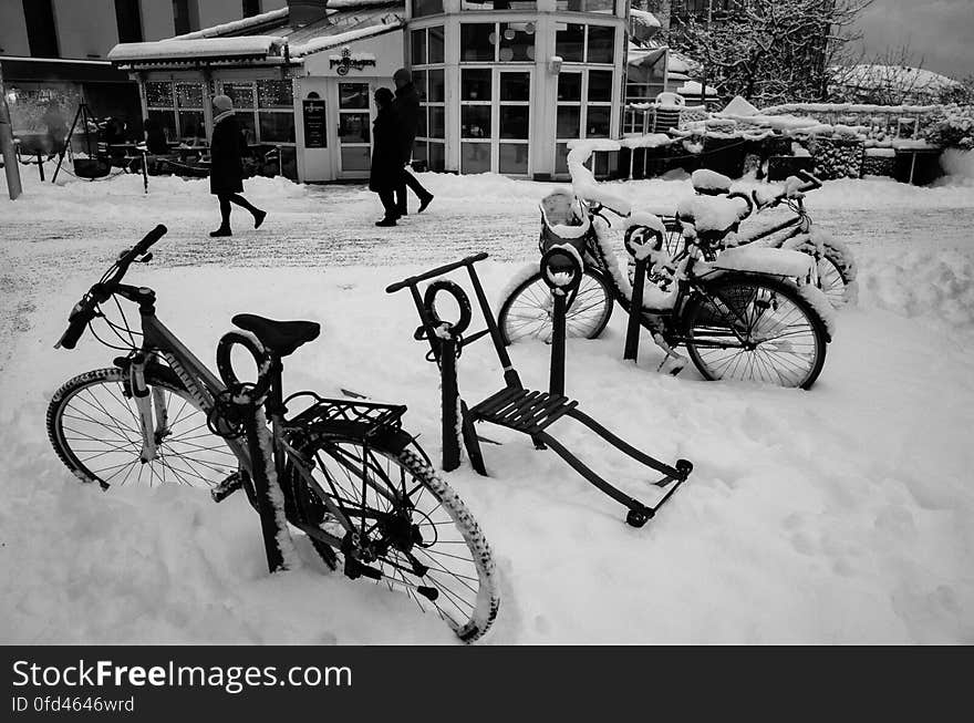 Winter parking outside a cafe in December in Bodø, above the arctic circle. A nightly snowfall has made the kicksled &#x28;&#x22;spark&#x22; in norwegian&#x29; a very useful means of transportation, much better than bicycles. It&#x27;s best used before the pathways and roads are sanded for the pedestrians. :&#x29;. Winter parking outside a cafe in December in Bodø, above the arctic circle. A nightly snowfall has made the kicksled &#x28;&#x22;spark&#x22; in norwegian&#x29; a very useful means of transportation, much better than bicycles. It&#x27;s best used before the pathways and roads are sanded for the pedestrians. :&#x29;