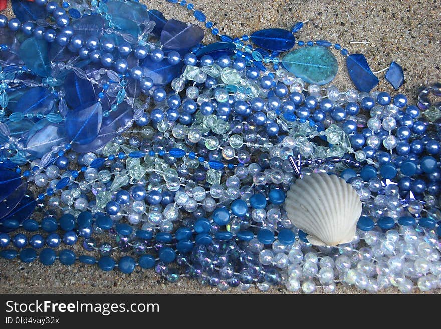 blue beads and glass with shell