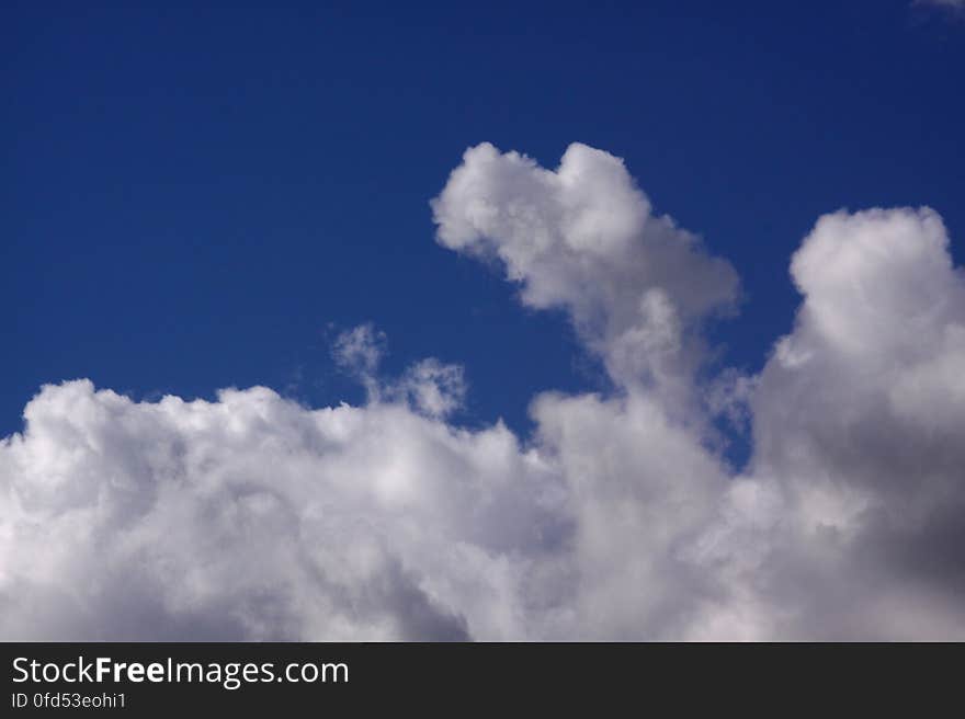 Interesting bits of a cloud against the blue sky. Interesting bits of a cloud against the blue sky.