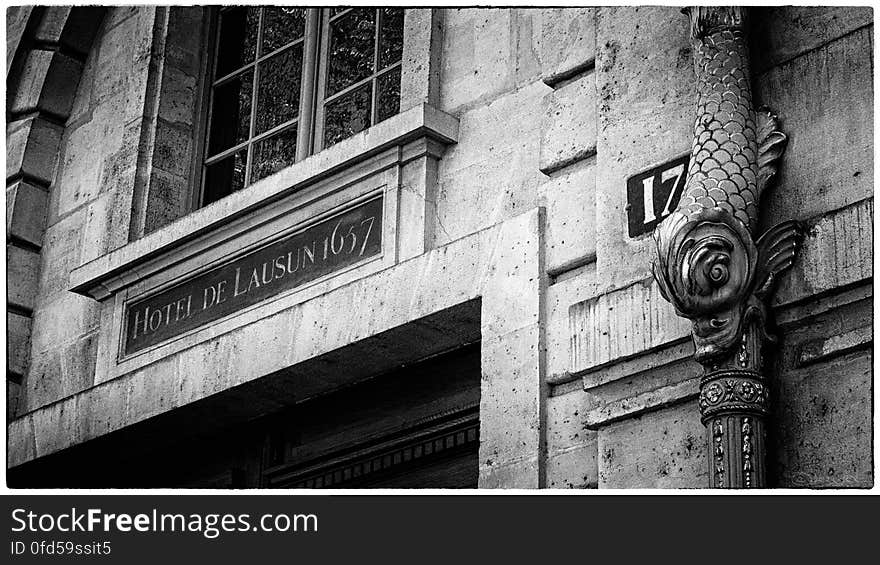 The hotel de Lausun on the Île Saint-Louis was built in 1657 and was the one-time residence of Baudelaire. The facade features a beautiful gilded dolphin downspout. The hotel de Lausun on the Île Saint-Louis was built in 1657 and was the one-time residence of Baudelaire. The facade features a beautiful gilded dolphin downspout.