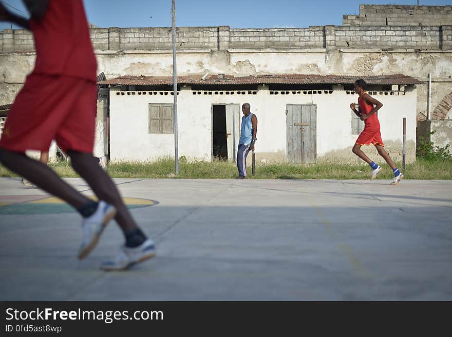 Basketball players run up the court, while their coach looks on, during a game in Mogadishu, Somalia, on June 6. Banned under the extremist group, Al Shabaab, Basketball is once again making a resurgence in Mogadishu. Today at least a dozen teams in the city play in a league and both men and women are coming out to play the sport. AU UN IST PHOTO / TOBIN JONES. Basketball players run up the court, while their coach looks on, during a game in Mogadishu, Somalia, on June 6. Banned under the extremist group, Al Shabaab, Basketball is once again making a resurgence in Mogadishu. Today at least a dozen teams in the city play in a league and both men and women are coming out to play the sport. AU UN IST PHOTO / TOBIN JONES