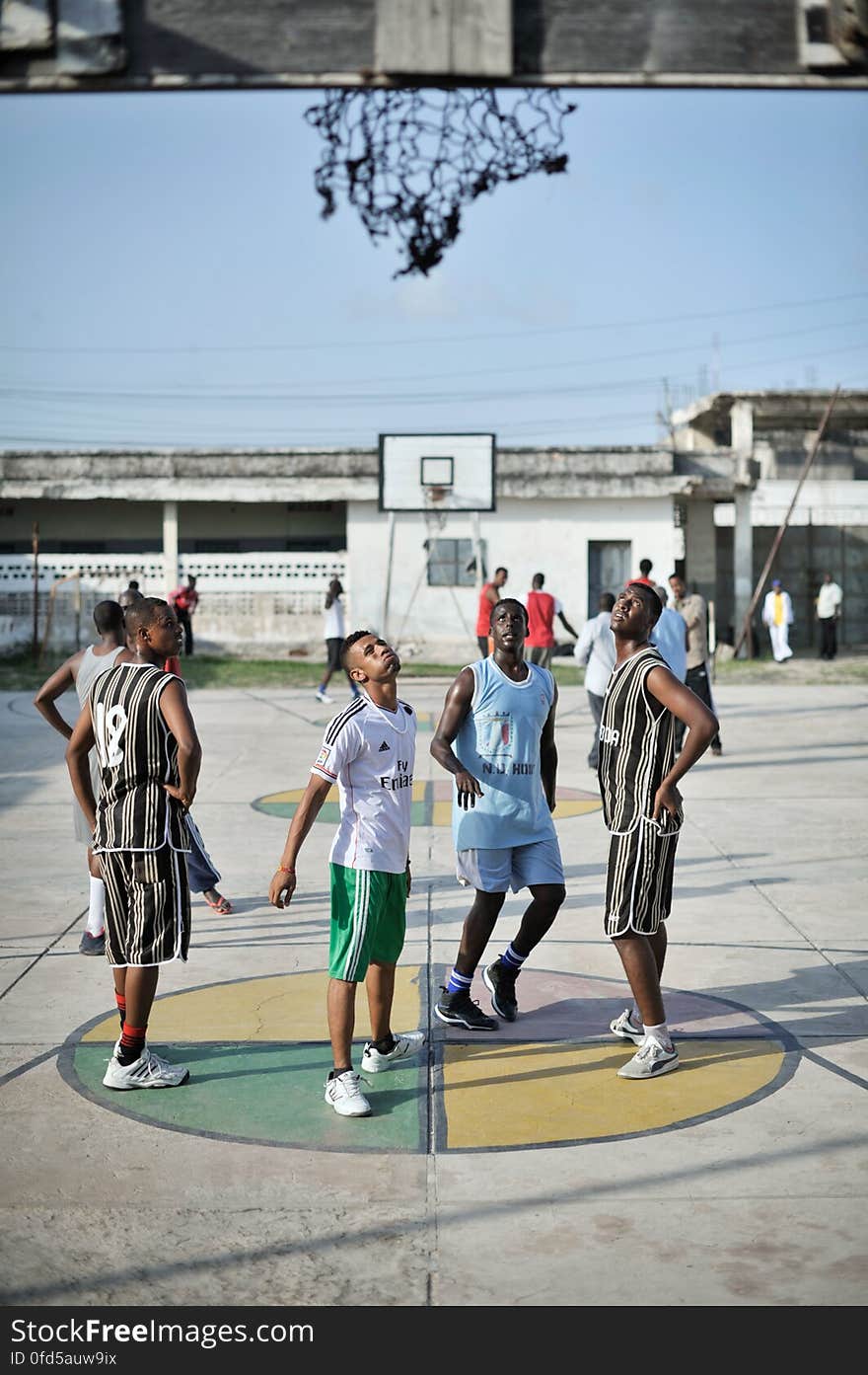 A group of young men watch as a basketball is shot during a practice session at a court in Mogadishu, Somalia, on June 6. Banned under the extremist group, Al Shabaab, Basketball is once again making a resurgence in Mogadishu. Today at least a dozen teams in the city already play in a league and both men and women are coming out to play the sport. AU UN IST PHOTO / TOBIN JONES. A group of young men watch as a basketball is shot during a practice session at a court in Mogadishu, Somalia, on June 6. Banned under the extremist group, Al Shabaab, Basketball is once again making a resurgence in Mogadishu. Today at least a dozen teams in the city already play in a league and both men and women are coming out to play the sport. AU UN IST PHOTO / TOBIN JONES