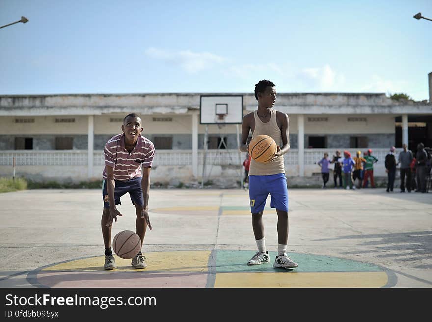 Two boys practice their shooting on a basketball court in Mogadishu, Somalia, on June 6. Banned under the extremist group, Al Shabaab, Basketball is once again making a resurgence in Mogadishu. Today at least a dozen teams in the city already play in a league and both men and women are coming out to play the sport. AU UN IST PHOTO / TOBIN JONES. Two boys practice their shooting on a basketball court in Mogadishu, Somalia, on June 6. Banned under the extremist group, Al Shabaab, Basketball is once again making a resurgence in Mogadishu. Today at least a dozen teams in the city already play in a league and both men and women are coming out to play the sport. AU UN IST PHOTO / TOBIN JONES