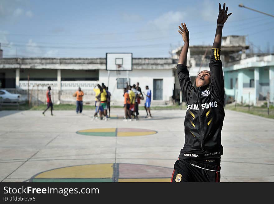 A girl takes a shot during a basketball training session in Mogadishu, Somalia, on June 6. Banned under the extremist group, Al Shabaab, Basketball is once again making a resurgence in Mogadishu. Today at least a dozen teams in the city play in a league and both men and women are coming out to play the sport. AU UN IST PHOTO / TOBIN JONES. A girl takes a shot during a basketball training session in Mogadishu, Somalia, on June 6. Banned under the extremist group, Al Shabaab, Basketball is once again making a resurgence in Mogadishu. Today at least a dozen teams in the city play in a league and both men and women are coming out to play the sport. AU UN IST PHOTO / TOBIN JONES