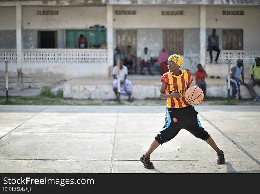 A girl dribbles a ball during basketball practice in Mogadishu, Somalia, on June 6. Banned under the extremist group, Al Shabaab, Basketball is once again making a resurgence in Mogadishu. Today at least a dozen teams in the city already play in a league and both men and women are coming out to play the sport. AU UN IST PHOTO / TOBIN JONES. A girl dribbles a ball during basketball practice in Mogadishu, Somalia, on June 6. Banned under the extremist group, Al Shabaab, Basketball is once again making a resurgence in Mogadishu. Today at least a dozen teams in the city already play in a league and both men and women are coming out to play the sport. AU UN IST PHOTO / TOBIN JONES