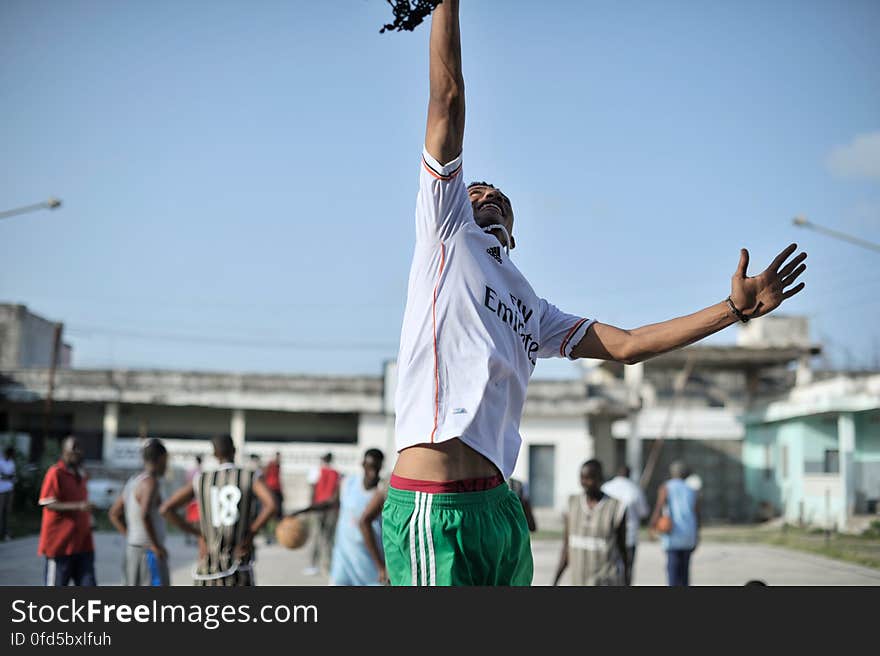 A basketball player in Mogadishu, Somalia, jump up to try and touch the rim during a practice session on June 6. Banned under the extremist group, Al Shabaab, Basketball is once again making a resurgence in Mogadishu. Today at least a dozen teams in the city play in a league and both men and women are coming out to play the sport. AU UN IST PHOTO / TOBIN JONES. A basketball player in Mogadishu, Somalia, jump up to try and touch the rim during a practice session on June 6. Banned under the extremist group, Al Shabaab, Basketball is once again making a resurgence in Mogadishu. Today at least a dozen teams in the city play in a league and both men and women are coming out to play the sport. AU UN IST PHOTO / TOBIN JONES